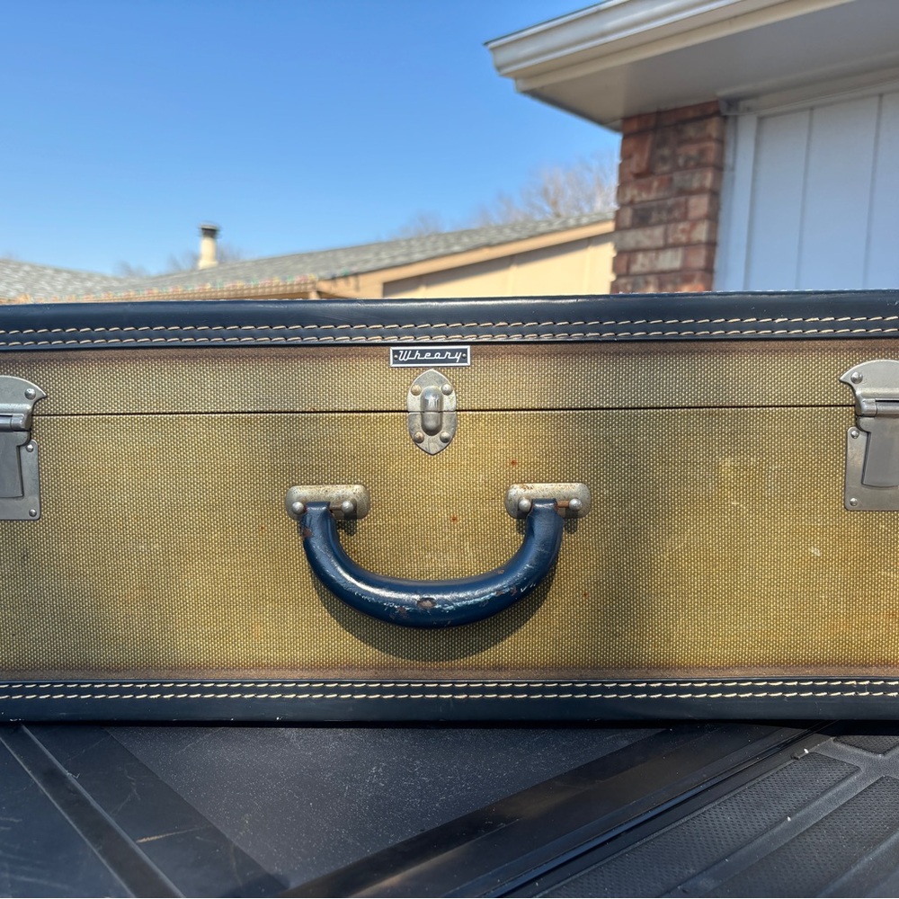 Wheary Suitcase Tan with Black Handle and Purple Silk lining . No keys